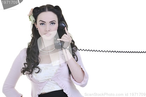 Image of pretty girl talking on old phone