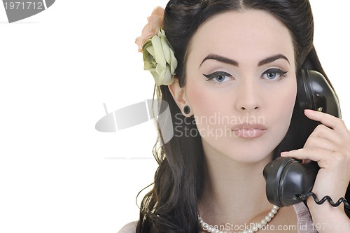 Image of pretty girl talking on old phone