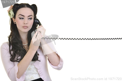 Image of pretty girl talking on old phone