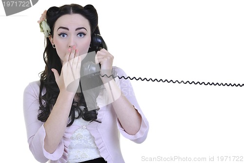 Image of pretty girl talking on old phone