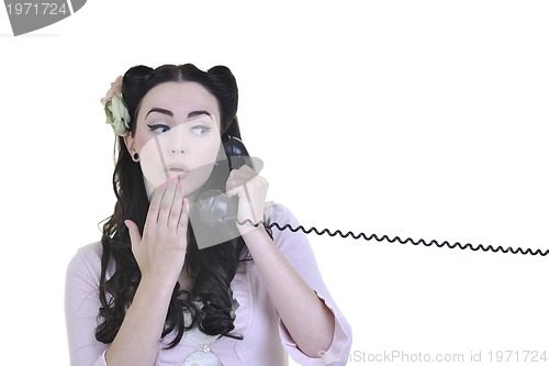 Image of pretty girl talking on old phone