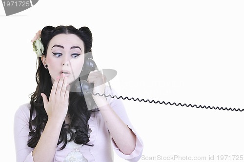 Image of pretty girl talking on old phone