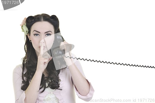 Image of pretty girl talking on old phone