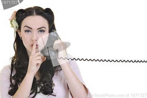 Image of pretty girl talking on old phone