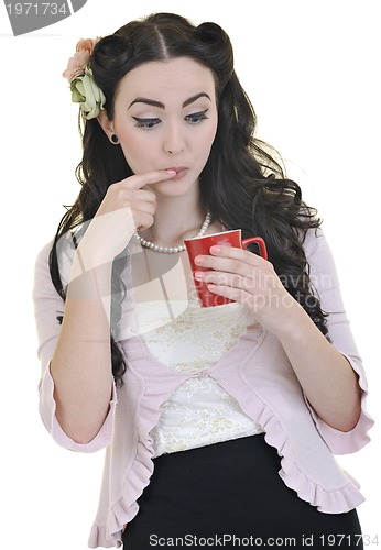 Image of beautiful young woman with red coup of coffee isolated on white