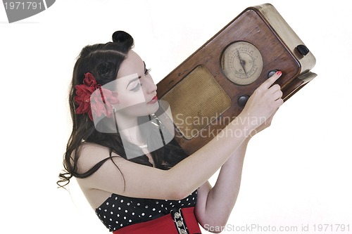 Image of pretty girl listening music on  radio