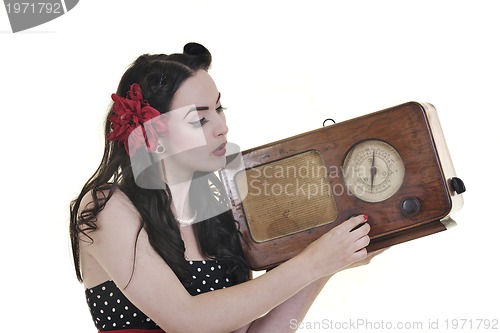 Image of pretty girl listening music on  radio