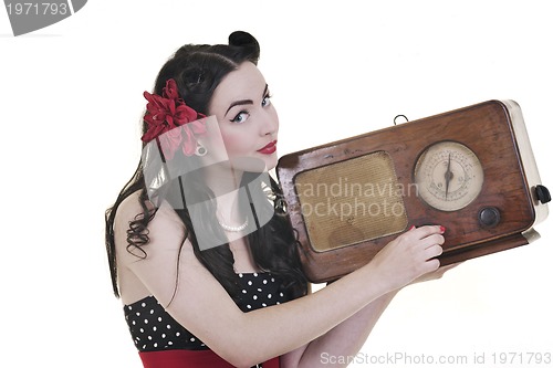 Image of pretty girl listening music on  radio