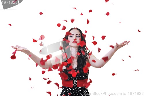 Image of woman with falling rose petals