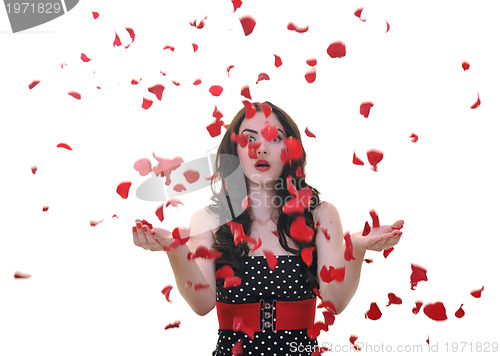 Image of woman with falling rose petals