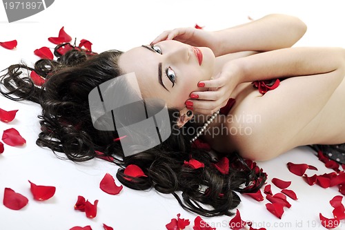 Image of beautiful young nude woman with roses isolated on white