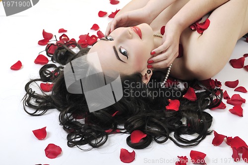 Image of beautiful young nude woman with roses isolated on white