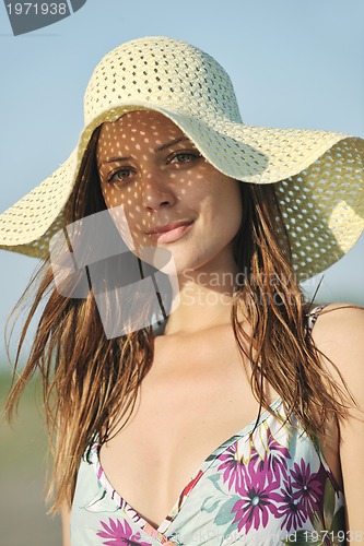 Image of young woman relax  on beach