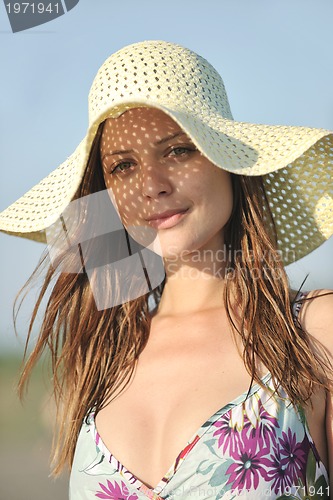 Image of young woman relax  on beach