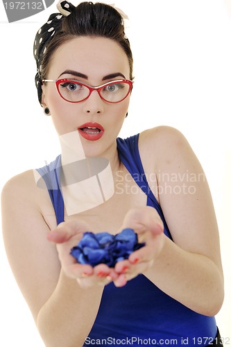 Image of young woman holding blue flower in hands