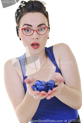 Image of young woman holding blue flower in hands