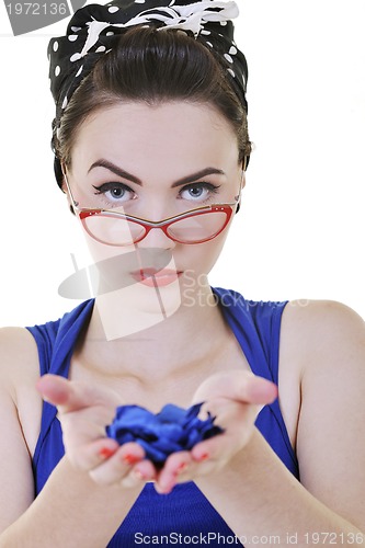 Image of young woman holding blue flower in hands