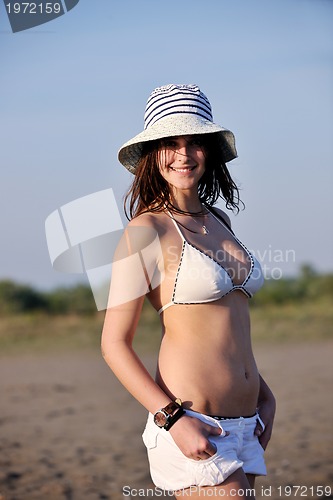 Image of young woman relax  on beach