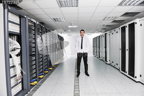 Image of young it engeneer in datacenter server room