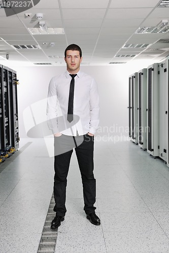 Image of young it engeneer in datacenter server room