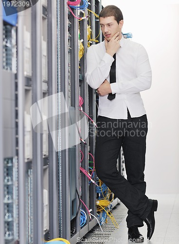 Image of young it engeneer in datacenter server room