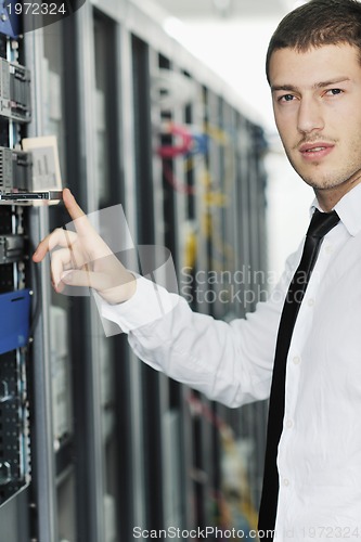 Image of young it engeneer in datacenter server room