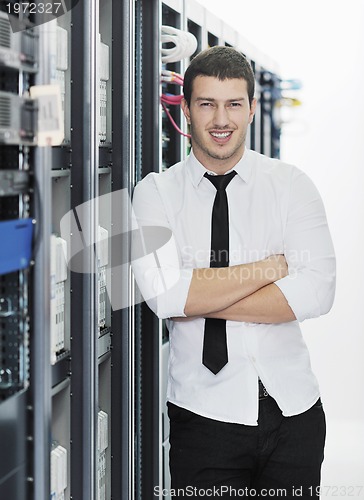 Image of young it engeneer in datacenter server room