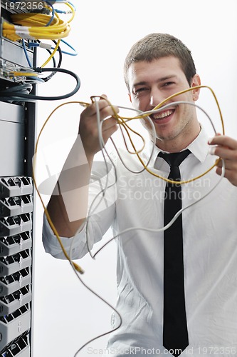 Image of young it engeneer in datacenter server room