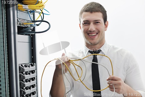 Image of young it engeneer in datacenter server room