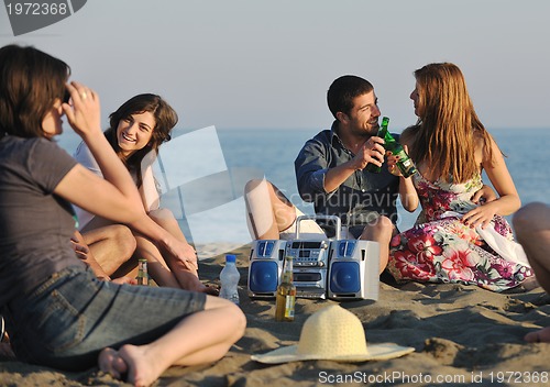 Image of happy young  people group have fun on beach