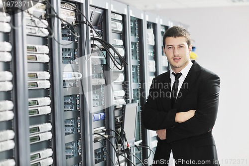 Image of young it engeneer in datacenter server room