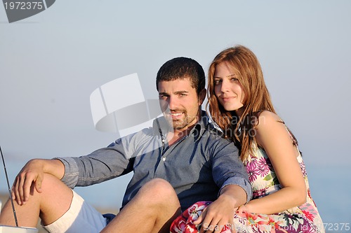 Image of happy young couple have fun on beach