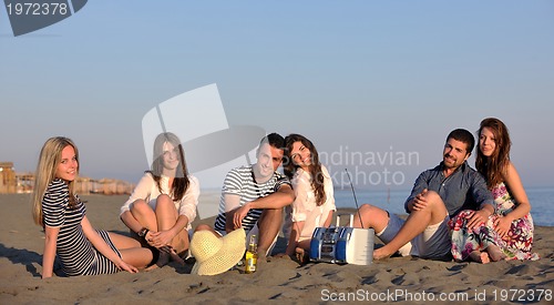 Image of happy young  people group have fun on beach
