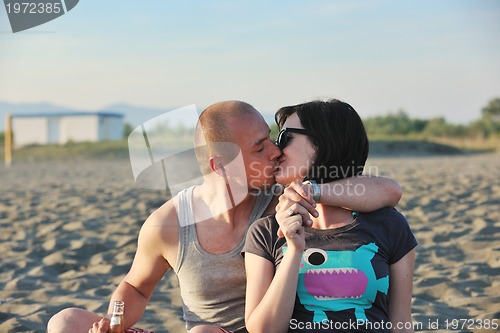 Image of happy young couple have fun on beach