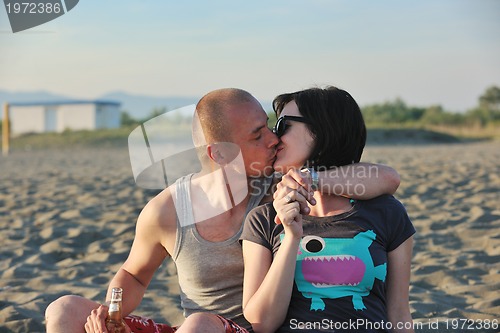 Image of happy young couple have fun on beach