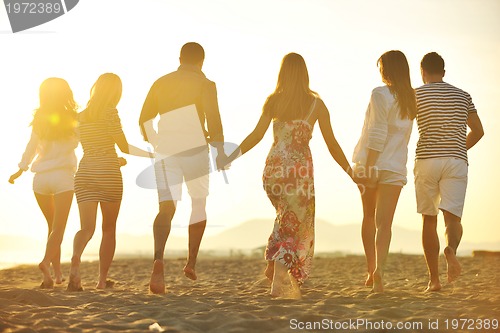 Image of happy young  people group have fun on beach
