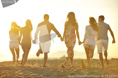 Image of happy young  people group have fun on beach