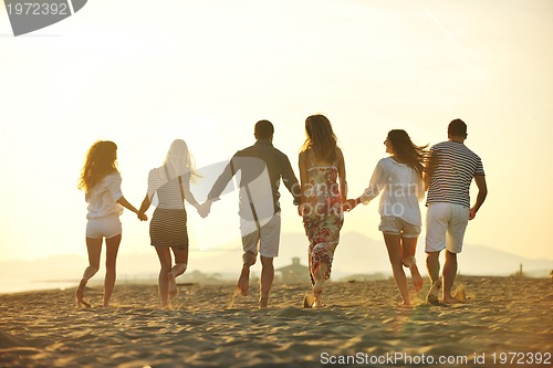 Image of happy young  people group have fun on beach