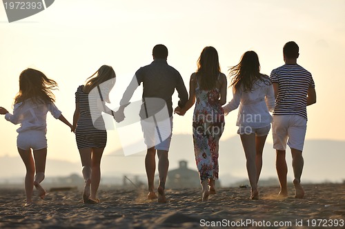 Image of happy young  people group have fun on beach