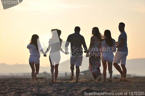 Image of happy young  people group have fun on beach