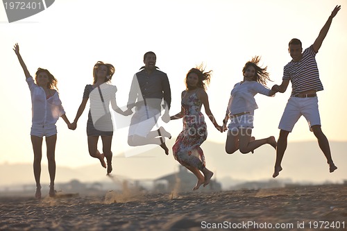 Image of happy young  people group have fun on beach