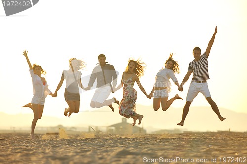 Image of happy young  people group have fun on beach