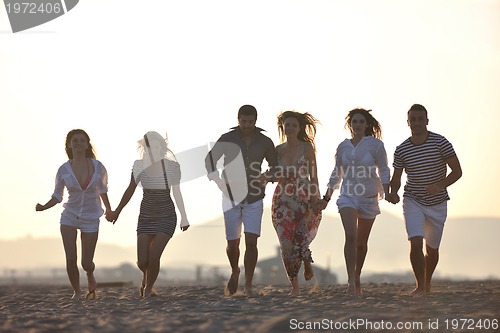 Image of happy young  people group have fun on beach