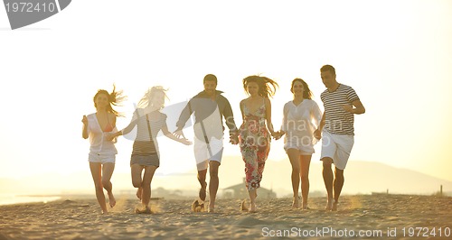 Image of happy young  people group have fun on beach