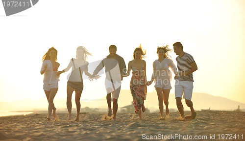 Image of happy young  people group have fun on beach