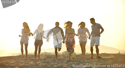 Image of happy young  people group have fun on beach