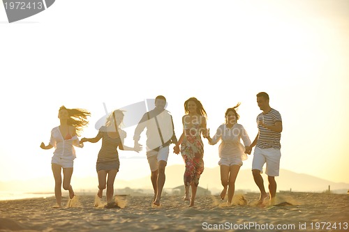 Image of happy young  people group have fun on beach