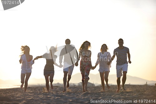 Image of happy young  people group have fun on beach