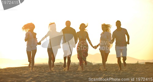 Image of happy young  people group have fun on beach