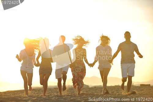 Image of happy young  people group have fun on beach